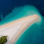 Aerial view of Zlatni Rat, Golden Cape, Brac Island, Croatia. Top view on summer beach travel in Adriatic Sea. Drone photo. Traveling concept.